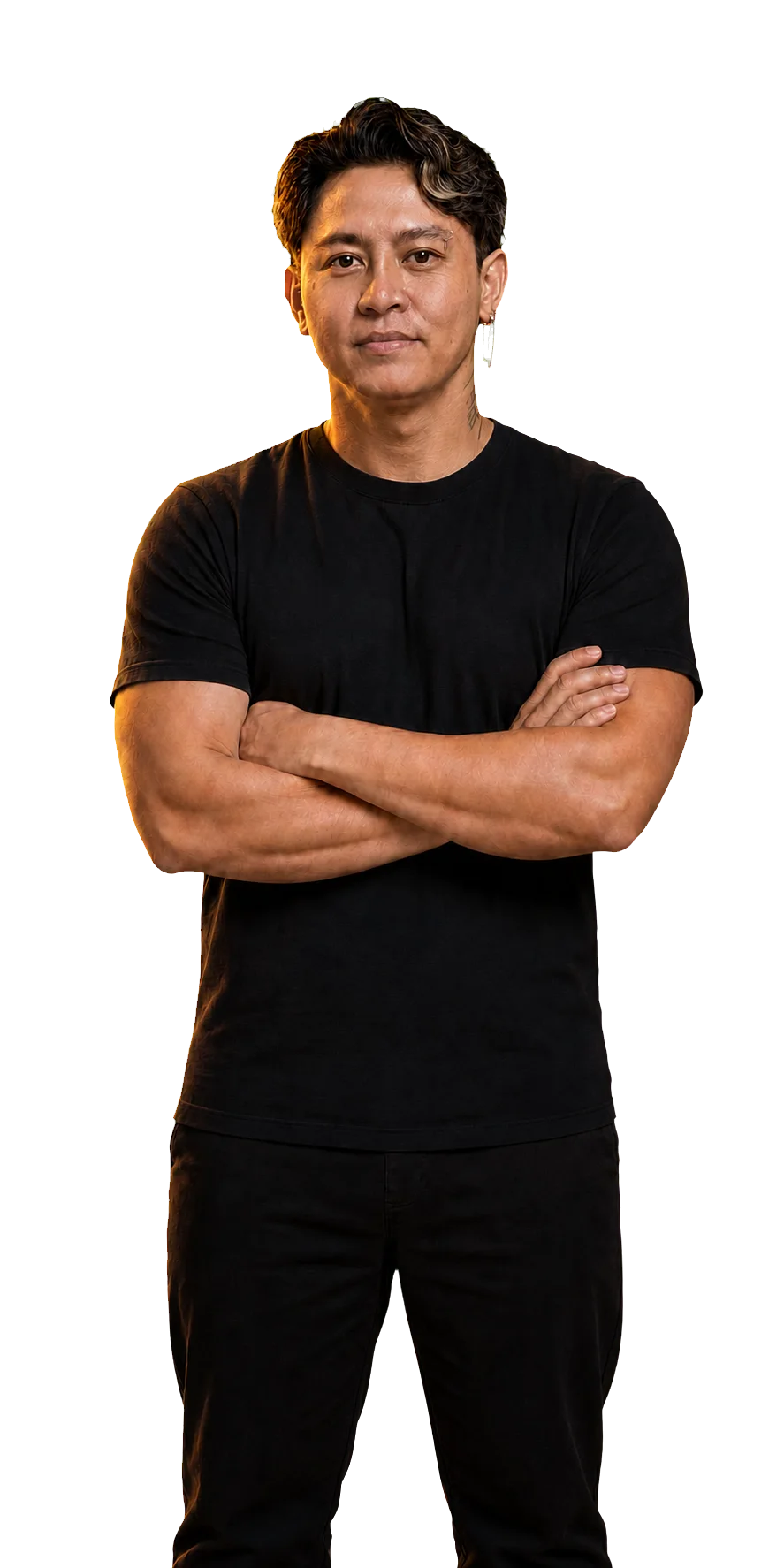 Tattoo artist Aurelio Dinorog III standing with his arms folded